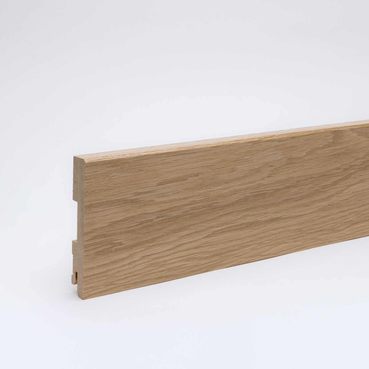 Plinthe bois massif 100mm biseautée bord d'attaque - Chêne verni